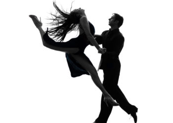 one caucasian couple man woman ballroom dancers tangoing  in silhouette studio on white background